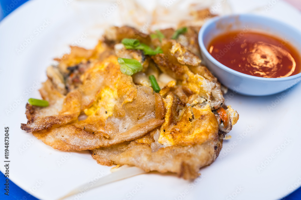 Asian delicious fried oysters with eggs omelette cuisine. Thai food Asian delicious fried oysters with eggs omelette cuisine. Thai food