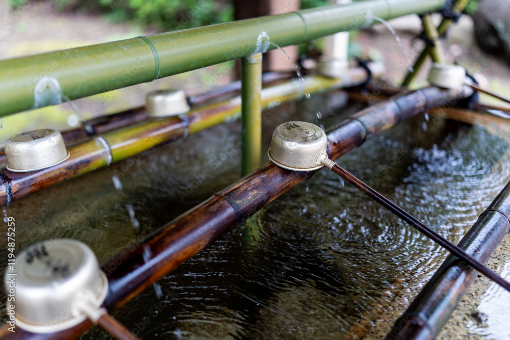 Temizuya with Fountain and Ladles to wash hands at Zojo-Ji Temple, Tokyo, Japan Temizuya with Fountain and Ladles to wash hands at Zojo-Ji Temple, Tokyo, Japan