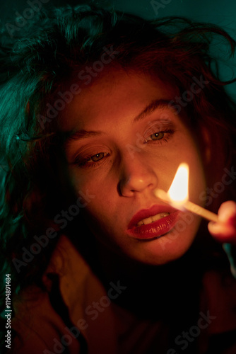 Photos Vertical medium close up of woman completely concentrated on burning math while