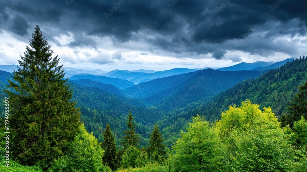 Obraz premium A serene mountain landscape under a dramatic cloudy sky.