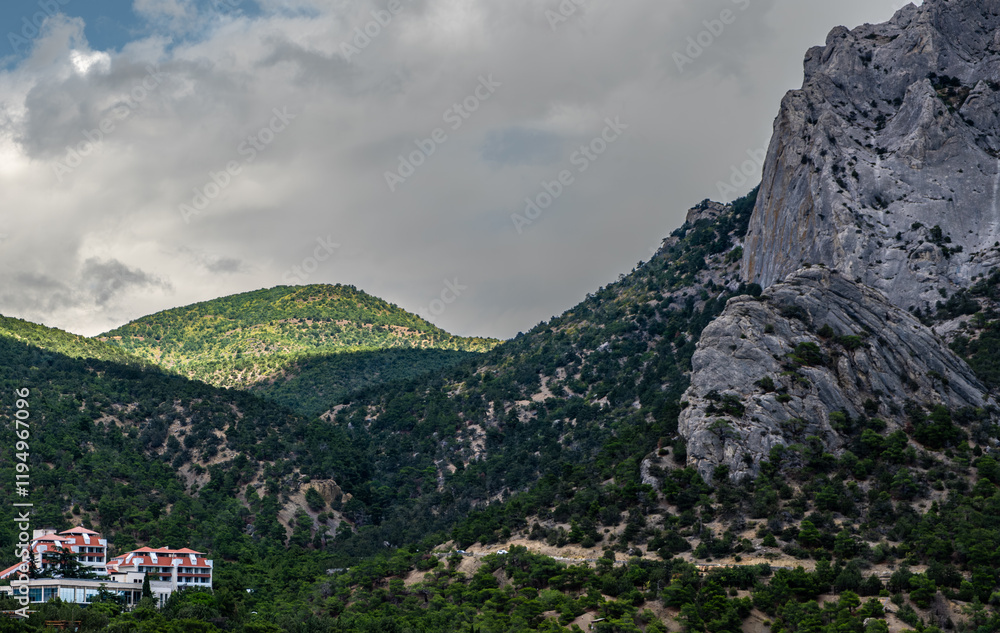Mountains covered with forest against the sky on a summer day. Mountains covered with forest against the sky on a summer day.