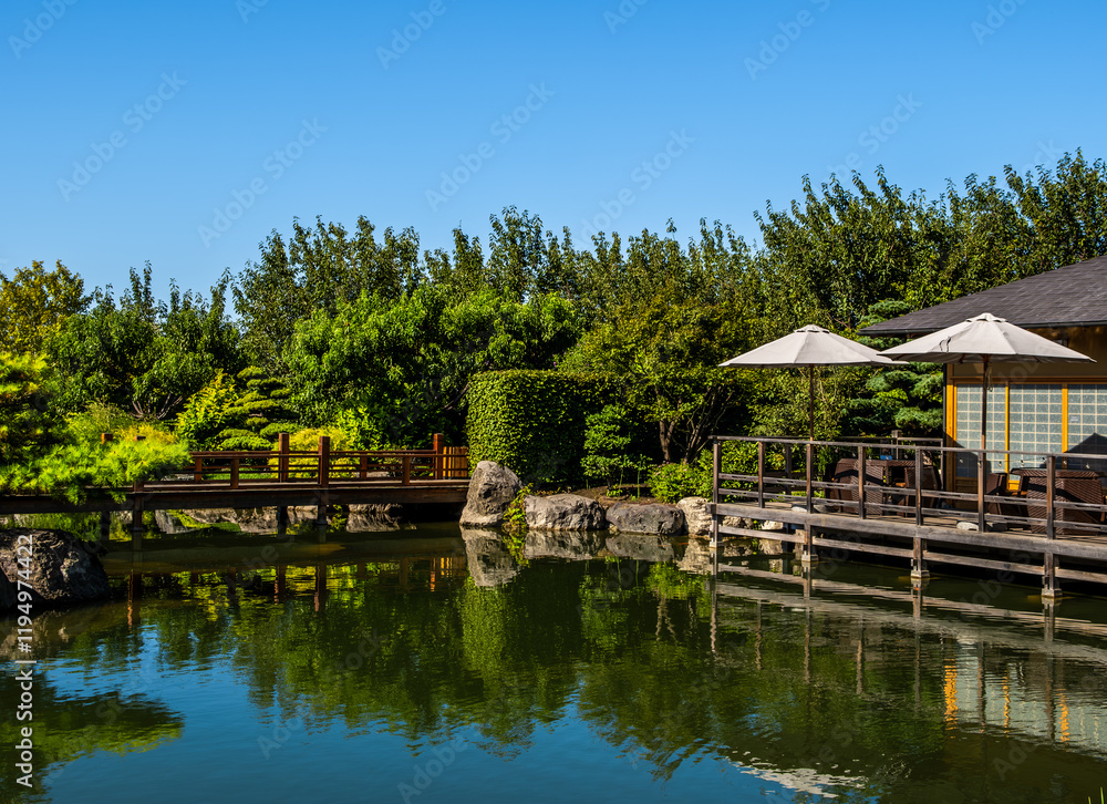 Japanese garden with pond and rocks on a summer day. Japanese garden with pond and rocks on a summer day.