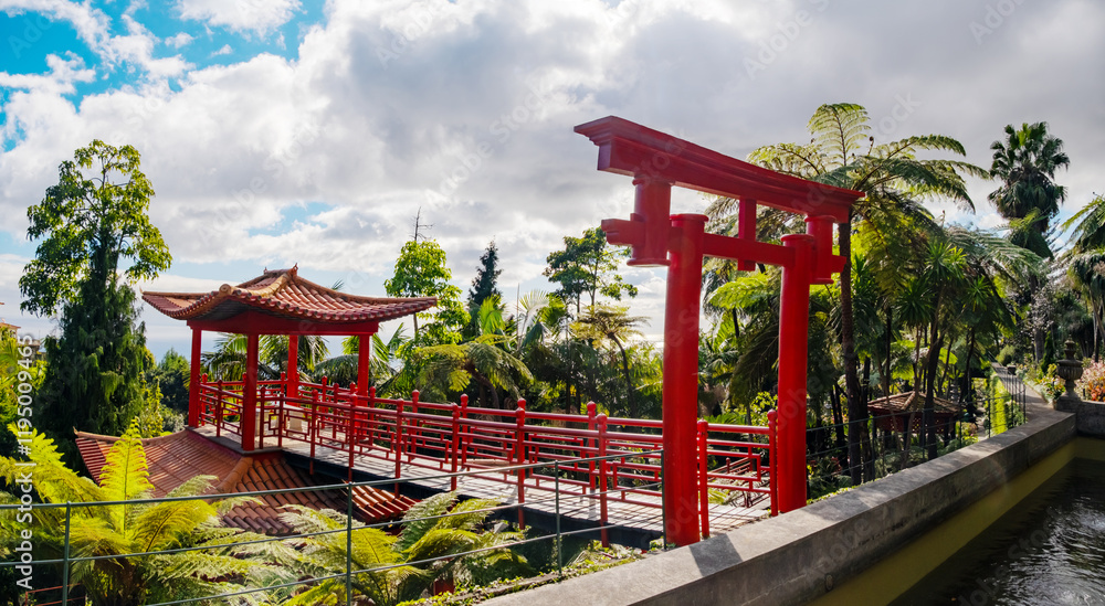 Monte Palace tropical garden with red pagoda, lakes and traditional buildings above the city of Funchal, popular tourist destination in Madeira island, Portugal Monte Palace tropical garden with red pagoda, lakes and traditional buildings above the city of Funchal, popular tourist destination in Madeira island, Portugal