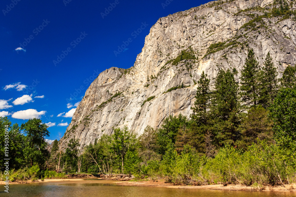 A mountain range with a river running through it A mountain range with a river running through it
