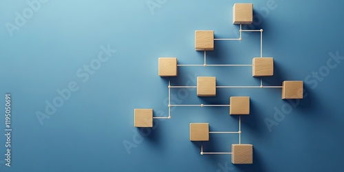 Wooden cube blocks arranged in a flowchart against a blue background symbolizing business process automation with shadows casting toward the bottom left