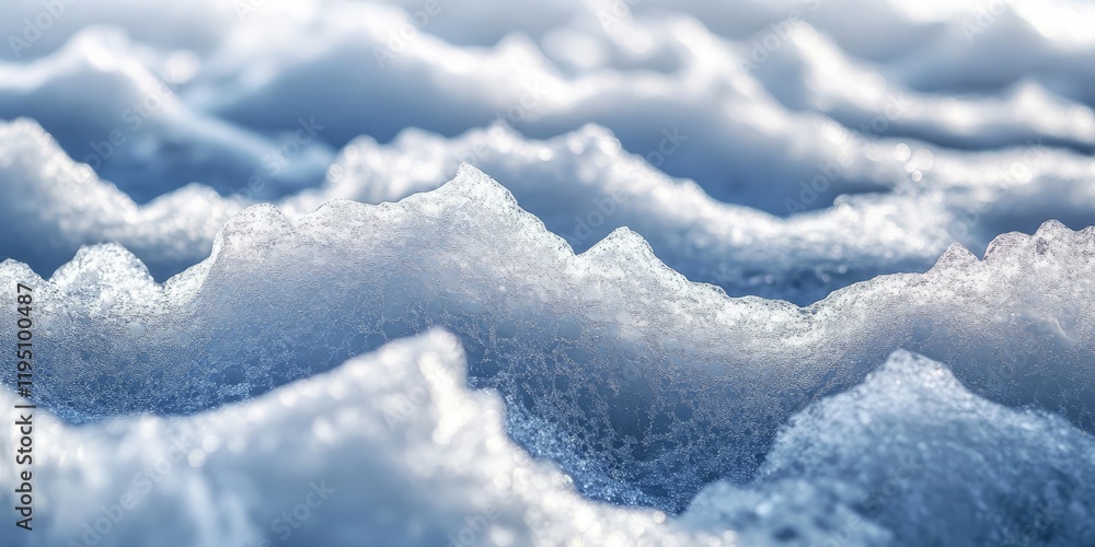 Closeup of textured ice crust on snowy surface with soft blue and white waves, capturing intricate details in light and shadow. Closeup of textured ice crust on snowy surface with soft blue and white waves, capturing intricate details in light and shadow.