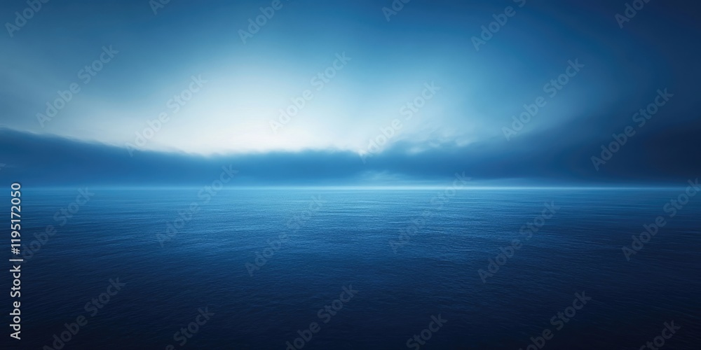 Obraz premium Gradient of soft blue tones against a deep dark ocean backdrop with calm water reflecting light, creating a serene and tranquil atmosphere.