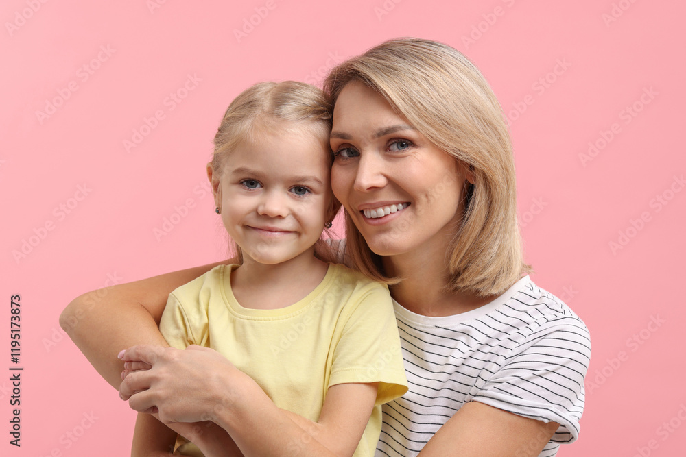 Cute little girl with her mom on pink background. Happy Mother's Day Cute little girl with her mom on pink background. Happy Mother's Day