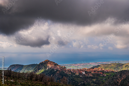 top view of the village of Grisolia with a cloudy sky in the background, Cosenza