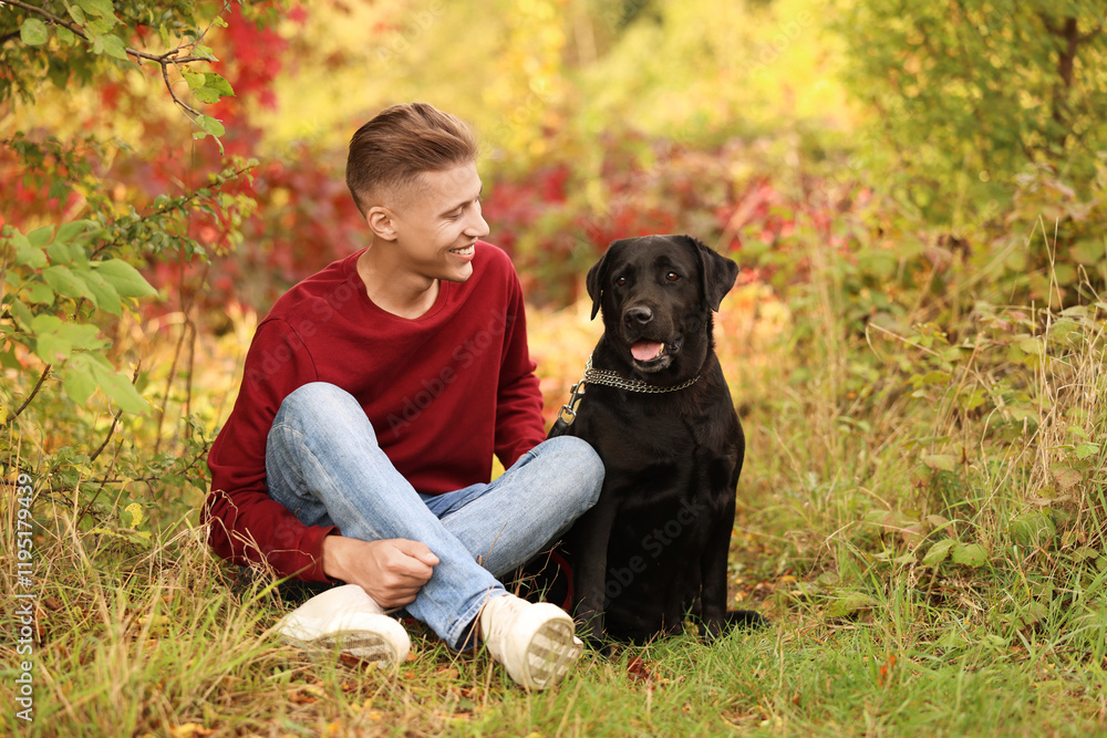 Smiling man with cute dog outdoors on autumn day Smiling man with cute dog outdoors on autumn day