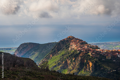 top view of the village of Grisolia with a cloudy sky in the background, Cosenza