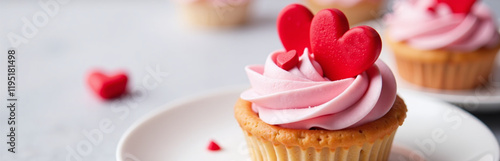 A Cupcake Or Tartlet With Pink Meringue Cream Is Decorated With Two Big Red Hearts And Small Heart Shape Candies. 00002