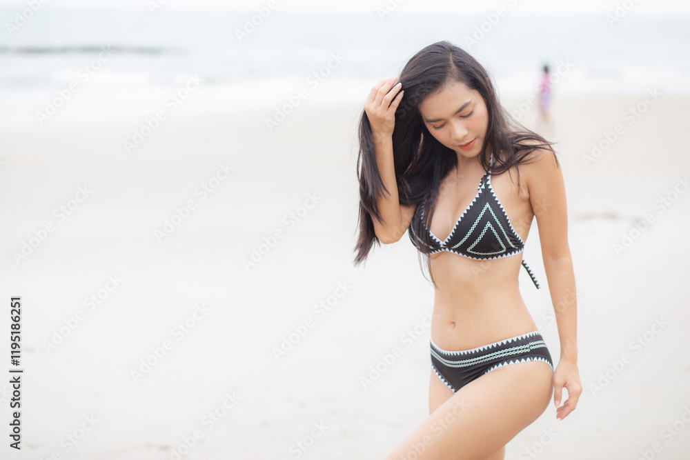 Beautiful young asian woman standing with happiness for relax on beach in tropical, happy woman in bikini with expression relaxation in holiday with seductive, recreation and leisure in summer. Beautiful young asian woman standing with happiness for relax on beach in tropical, happy woman in bikini with expression relaxation in holiday with seductive, recreation and leisure in summer.