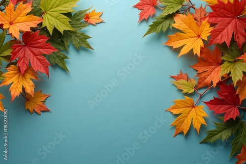 Colorful seasonal foliage on blue background: red, orange, yellow, and green leaves