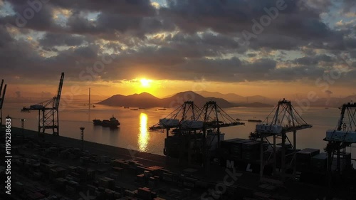 a view of an industrial port at sunset