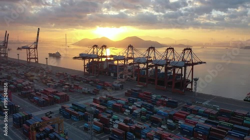 a view of an industrial port at sunset