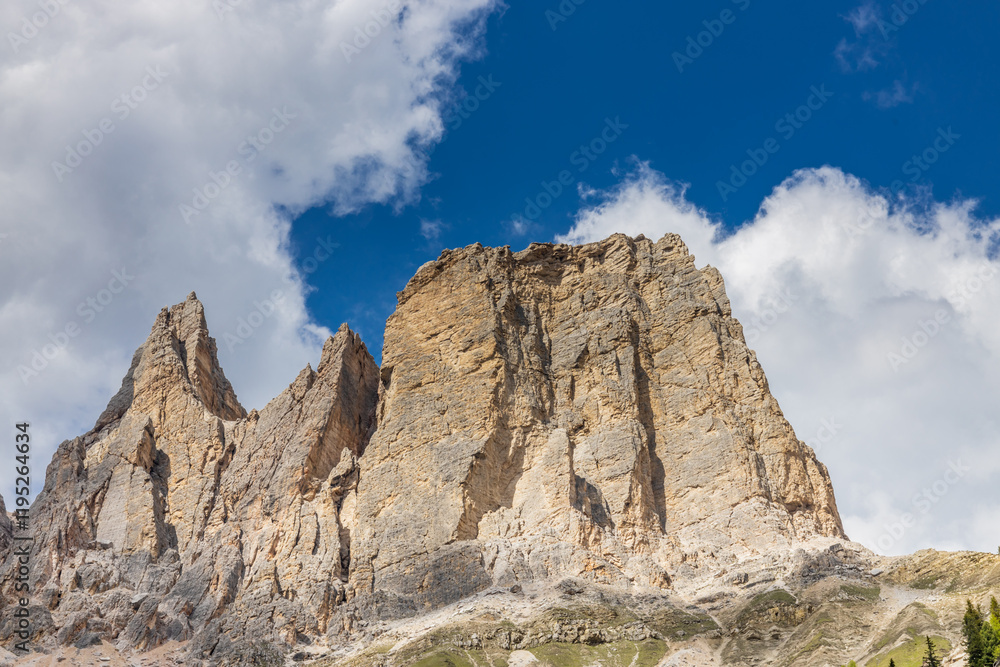 Dolomites rocky summits in the Alps. High tower peaks and sharp mountain rocky peaks of the Alps in the Dolomiti region, Italy. Beautiful scenic mountain range landscape in summer Dolomites rocky summits in the Alps. High tower peaks and sharp mountain rocky peaks of the Alps in the Dolomiti region, Italy. Beautiful scenic mountain range landscape in summer