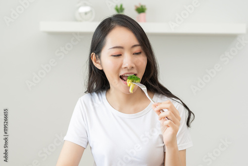 young female planning menu to eat ketogenic diet during weight loss program. photo