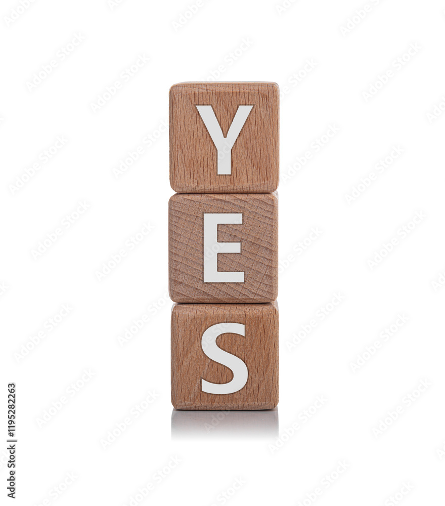 Wooden cubes with the inscription YES on a white background.