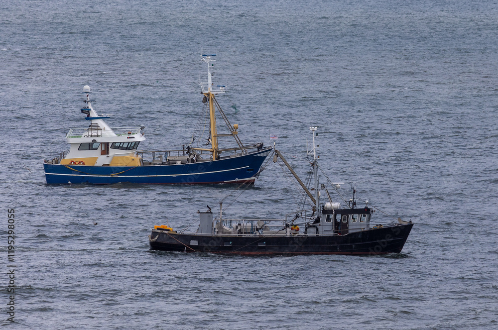 Two fishing vessels side by side in the North sea near to Egmond aan Zee Two fishing vessels side by side in the North sea near to Egmond aan Zee