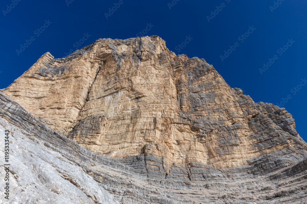 Dolomites rocky summits in the Alps. High tower peaks and sharp mountain rocky peaks of the Alps in the Dolomiti region, Italy. Beautiful scenic mountain range landscape in summer Dolomites rocky summits in the Alps. High tower peaks and sharp mountain rocky peaks of the Alps in the Dolomiti region, Italy. Beautiful scenic mountain range landscape in summer