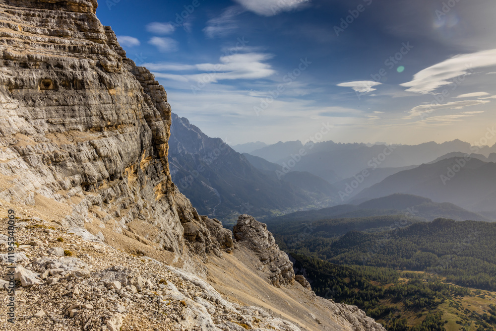 Fototapeta premium Dolomites rocky summits in the Alps. High tower peaks and sharp mountain rocky peaks of the Alps in the Dolomiti region, Italy. Beautiful scenic mountain range landscape in summer