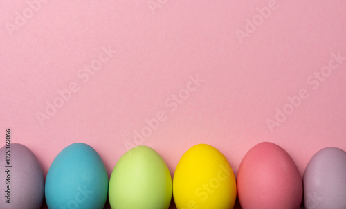 Photography Colorful easter eggs on pink background with copy space for text