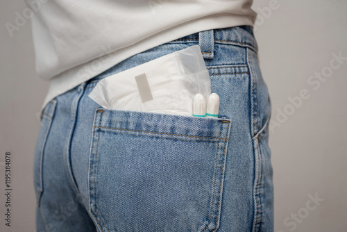 There is a sanitary pad and tampons in the jeans pocket.