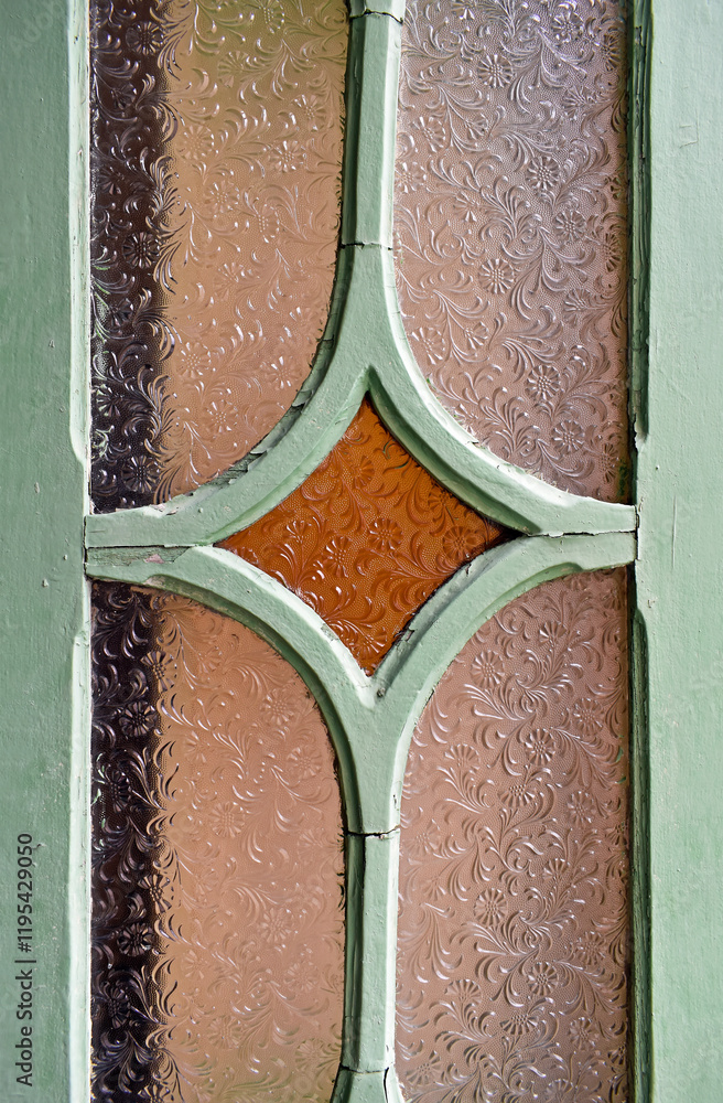 Window detail with ancient engraved glass in Teresopolis, Rio de Janeiro, Brazil