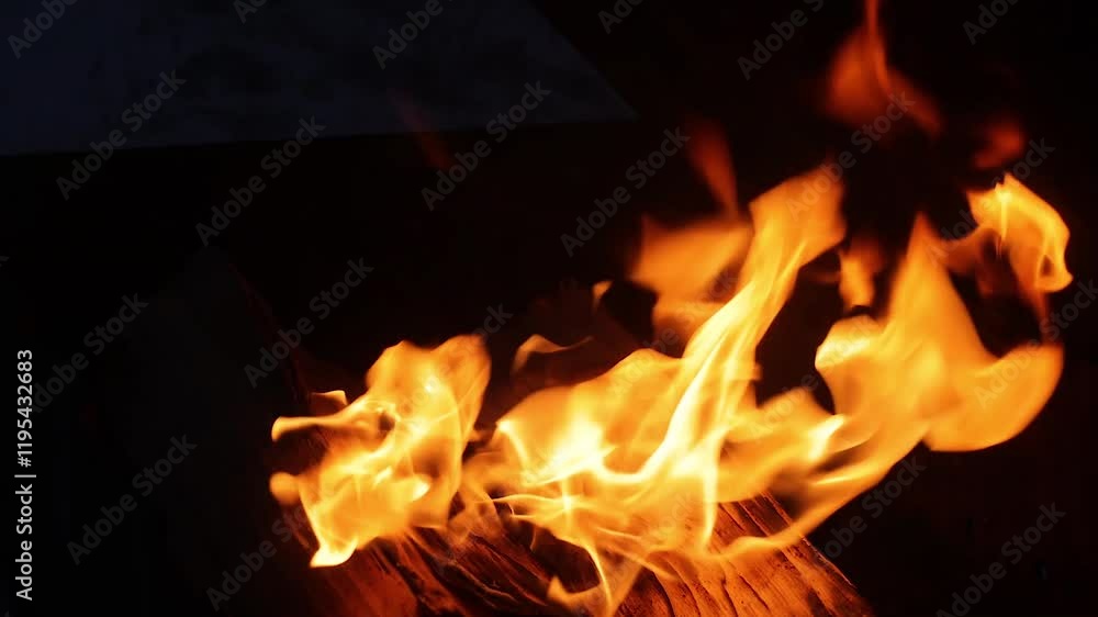 burning log on fire on dark background, fire flame as background
burning log on fire on dark background, fire flame as background