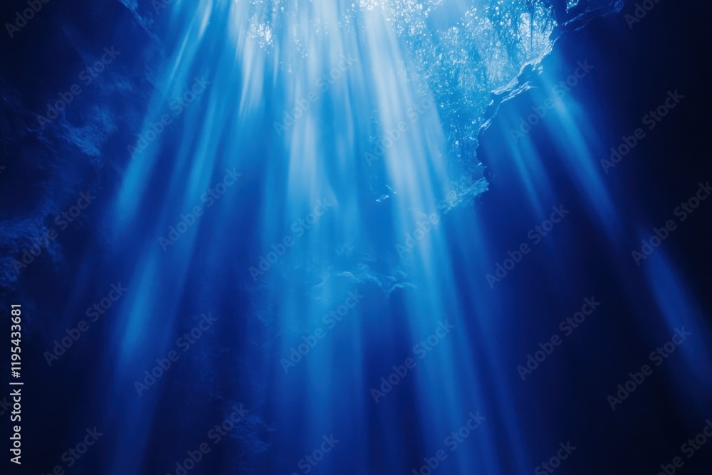 Obraz premium Ethereal Light Rays Cascading through Deep Water