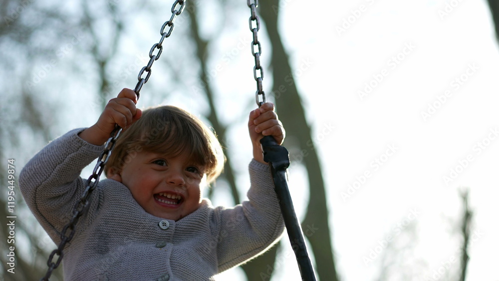 Little toddler child turning at playground swing Little toddler child turning at playground swing