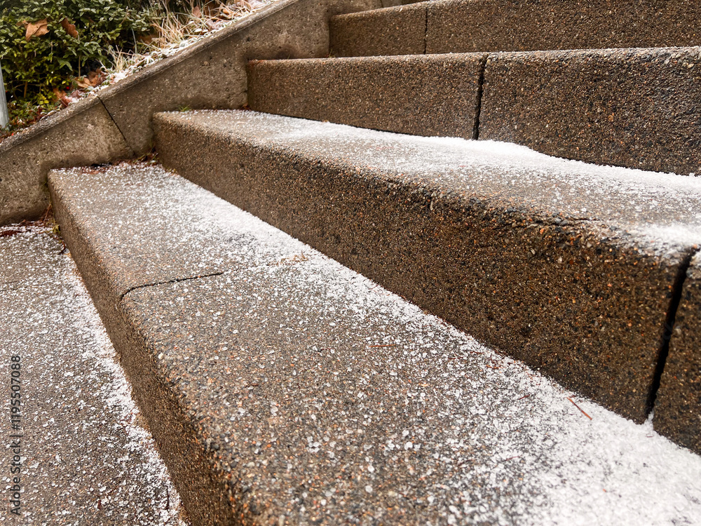 Close up of stone steps outdoors covered with iced snow and salt Close up of stone steps outdoors covered with iced snow and salt