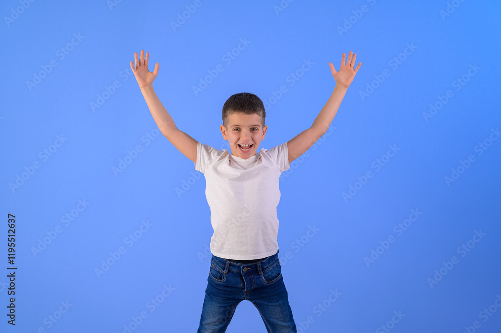 Portrait of adorable cute boy with arms raised screaming and standing isolated over blue background Portrait of adorable cute boy with arms raised screaming and standing isolated over blue background