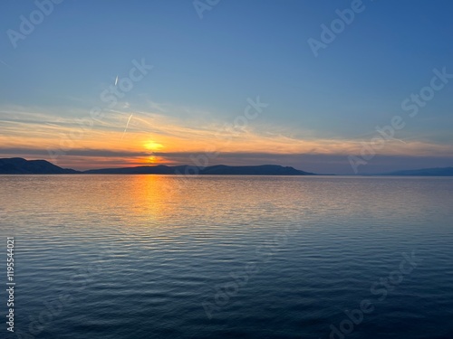 Sunset over the Adriatic Sea in the area at the foot of the Velebit mountain - Jablanac, Croatia (Zalazak sunca nad Jadranskim morem u podvelebitskom području - Jablanac, Hrvatska) photo