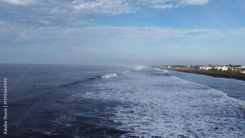 black sand beach white wake fly by drone footage and surfers black sand beach white wake fly by drone footage and surfers