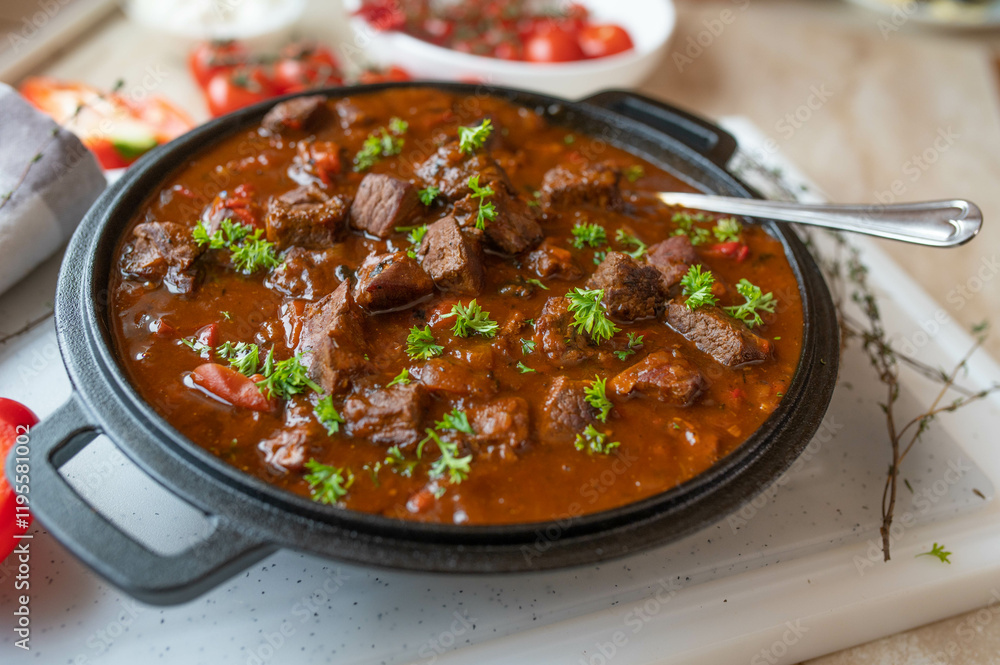 Paprika goulash with half pork and half beef meat in a delicious spicy sauce fresh and homemade cooked Paprika goulash with half pork and half beef meat in a delicious spicy sauce fresh and homemade cooked