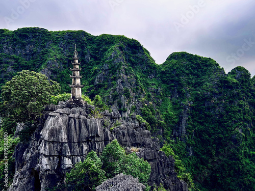 Pagoda on a limestone mountain top viewpoint in Hang Mua Cave, Tam Coc, Vietnam. photo