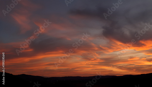 cielo al tramonto in un paesaggio rurale con nuvole multicolori, sky at sunset in a rural landscape with multicolored clouds photo