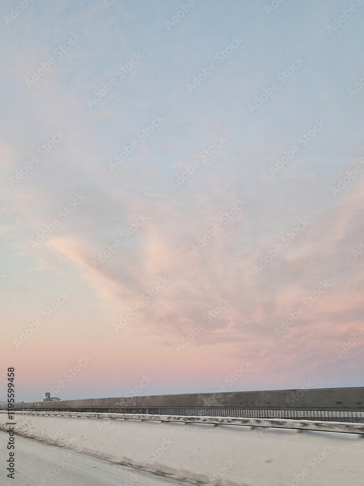Winter landscape of pink clouds in the sky before sunset Winter landscape of pink clouds in the sky before sunset
