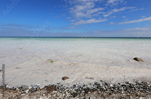 view with the clear salt waters of the Baltic Sea due to the calcium carbonate melts crashing on the rocky shore