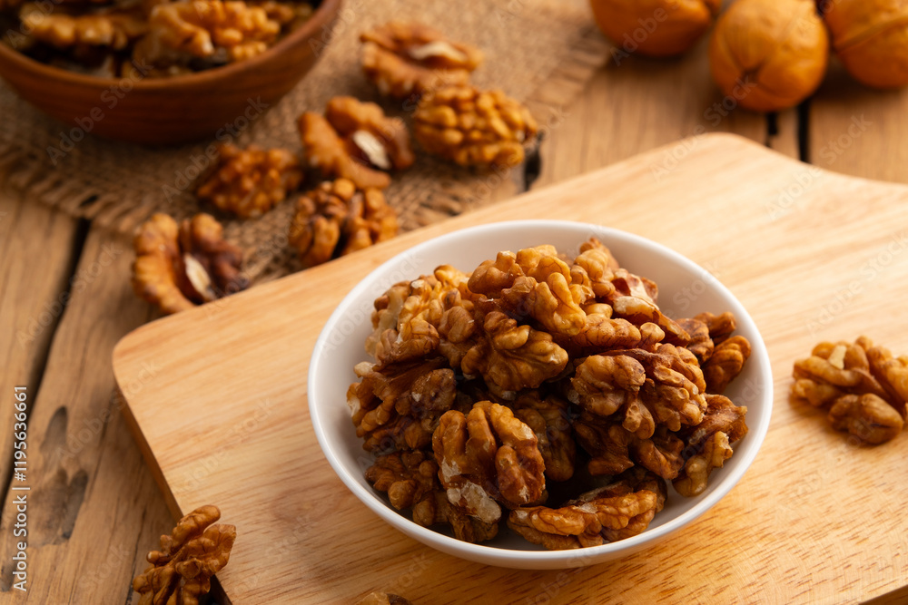 Walnut kernel and whole walnuts on a plate.Healthy Fats,Support weight management. Walnut kernel and whole walnuts on a plate.Healthy Fats,Support weight management.