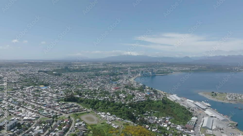 Aerial View of a Hilltop Cross Overlooking a Bay and Mountains Aerial View of a Hilltop Cross Overlooking a Bay and Mountains