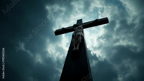 Easter: Low Angle Shot of Jesus Christ on the Cross with Dramatic Clouds