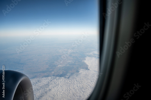 View from the airplane window on beautiful clouds. View of the earth from above. Low-cost flight.
