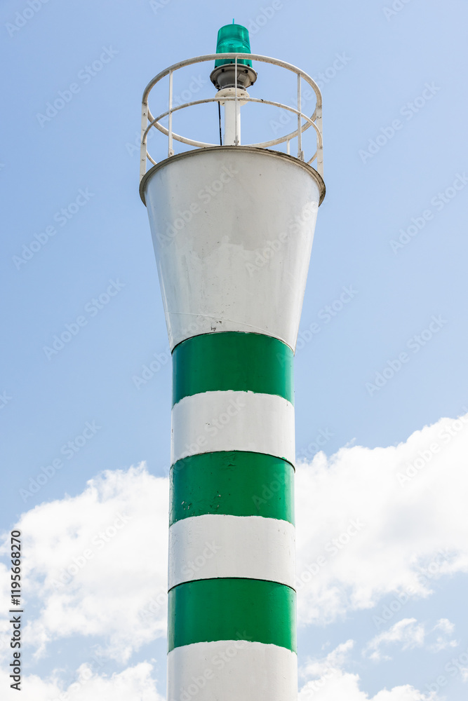 Coastal navigation mark, banded green white lighthouse tower Coastal navigation mark, banded green white lighthouse tower