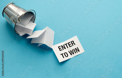 Lottery or to draw lots. To enter a competition or lottery to win a prize. Text Enter to Win photo