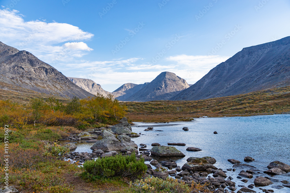 View to Petrelius river valley at Khibiny mountains. Early autumn in arctic tundra region. Kola peninsula, Murmansk region, Russia.