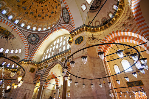 interior of mosque, domes are painted with patterns, decorative windows and columns, chandeliers, beautiful architecture of Islamic religion, Istanbul, Turkey