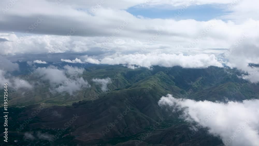 This image showcases an expansive view of green mountains surrounded by clouds. The partially cloudy sky highlights the serene and captivating beauty of nature.
This image showcases an expansive view of green mountains surrounded by clouds. The partially cloudy sky highlights the serene and captivating beauty of nature.